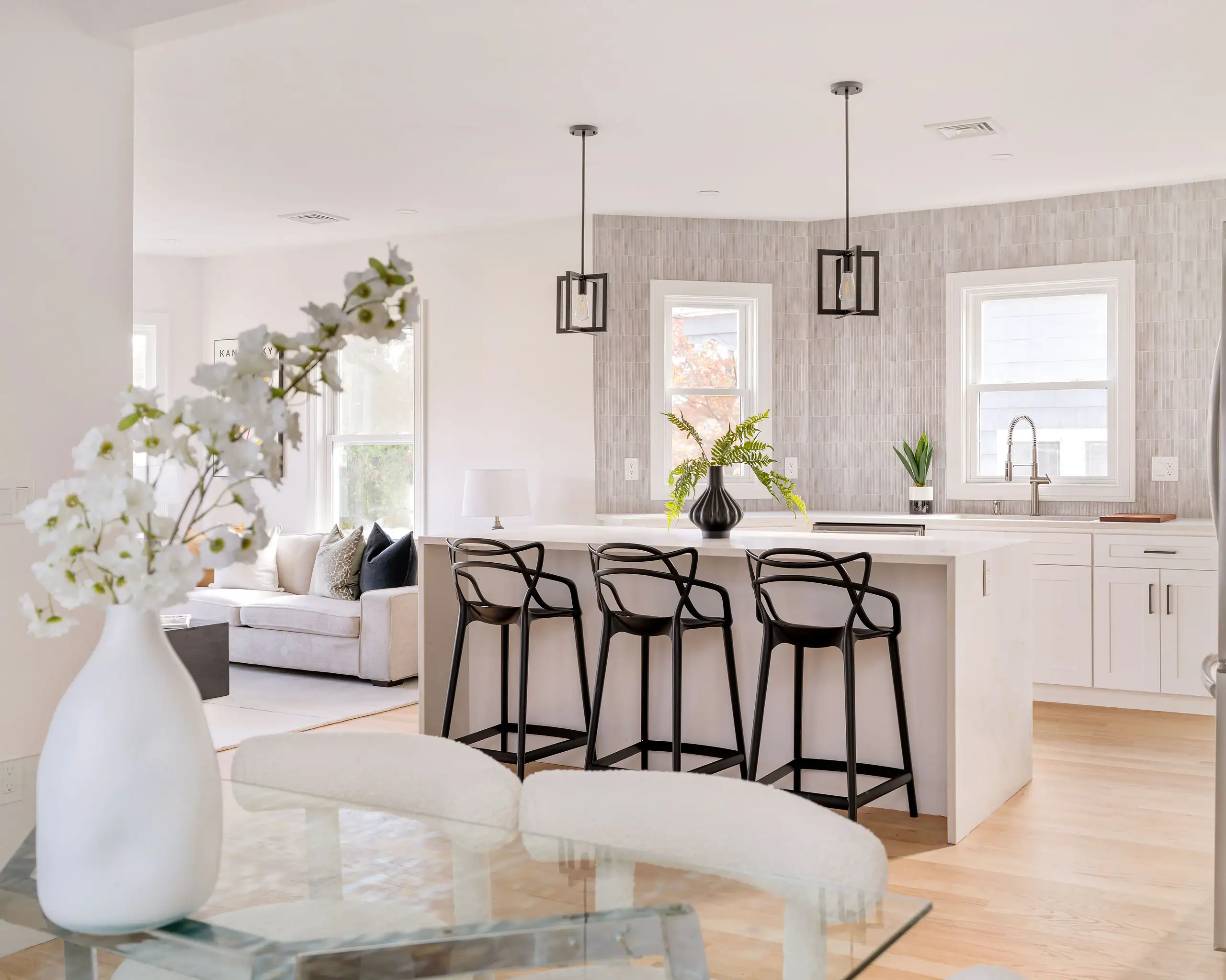 Modern open-concept kitchen with island and neutral design in Boston home