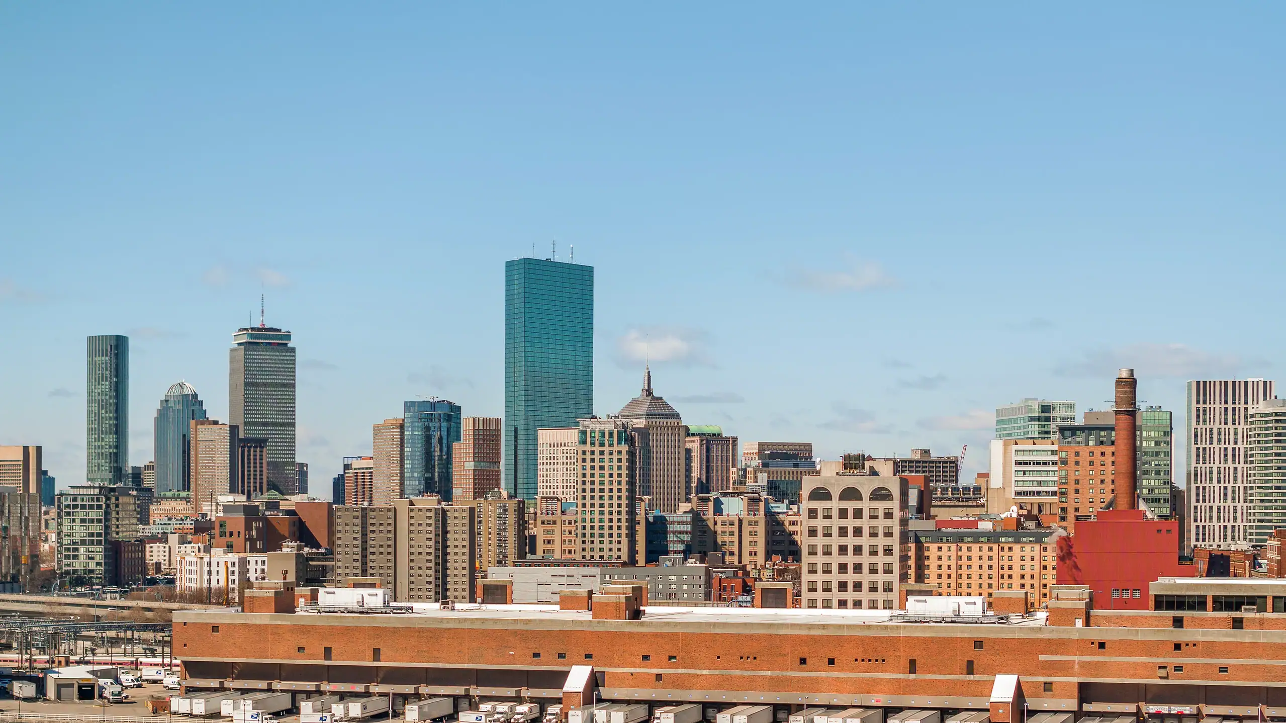 Boston skyline with turquoise-topped building and historic brick architecture downtown waterfront